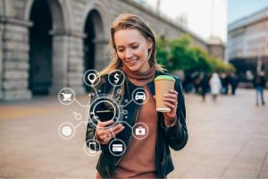 Woman with coffee and smart phone