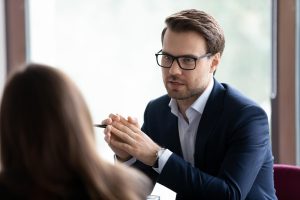 business man and woman discussing what to look for in a managed services provider